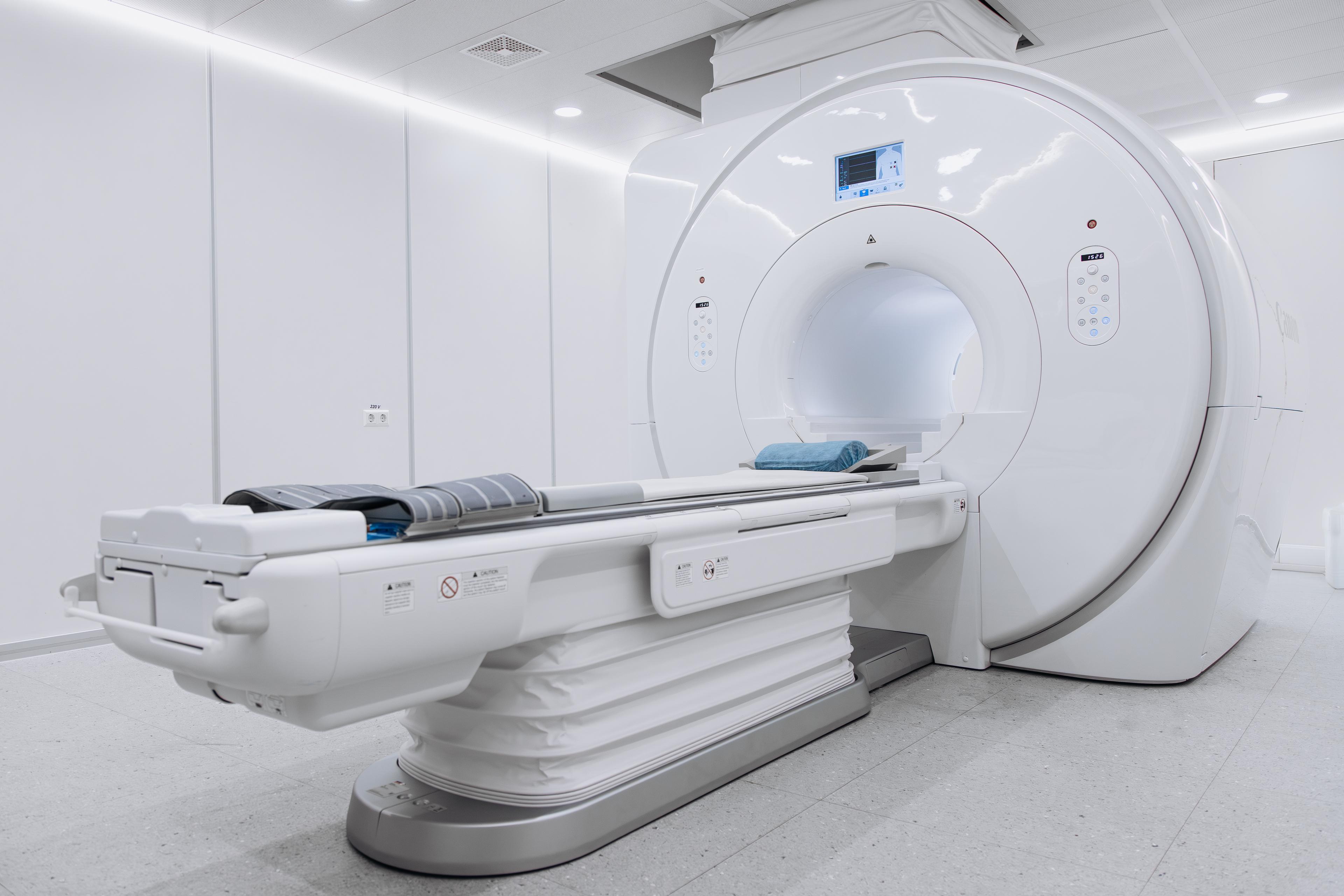 MRI Service: MRI scanner bore and patient table in imaging suite
